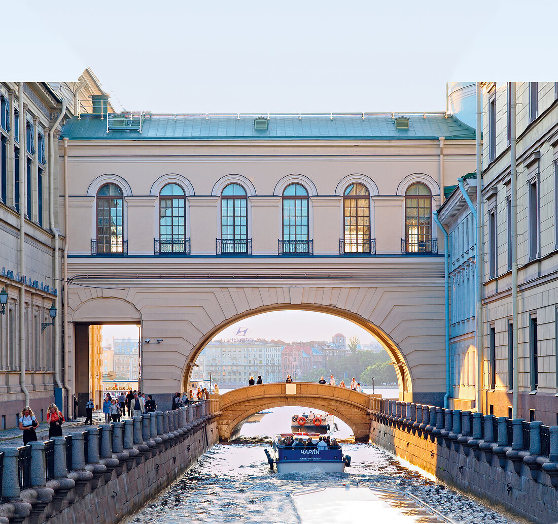 People and boat at Griboyedov Canal in Saint Petersburg, Russia
