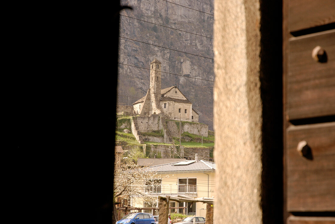 View of church of Santa Maria del Castello from door frame in Ticino, Switzerland