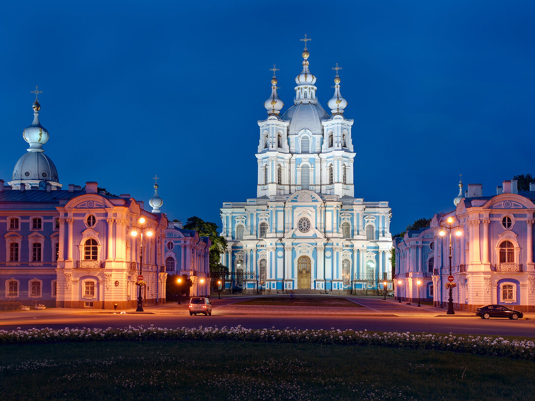 Facade of illuminated Smolny Cathedral at night in St. Petersburg, Russia