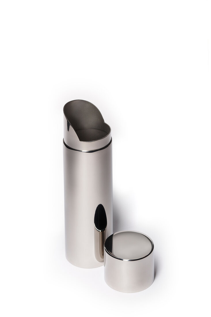 Stainless steel tea caddy on white background