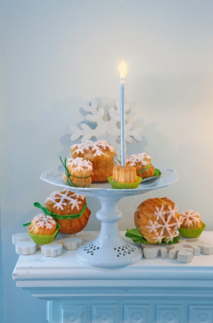 Lemon cake with snow-flake frosting and a candle