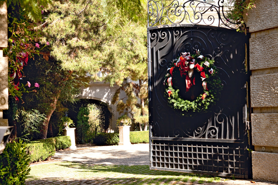 Open iron gate at North Carolwood, Los Angeles, California, USA