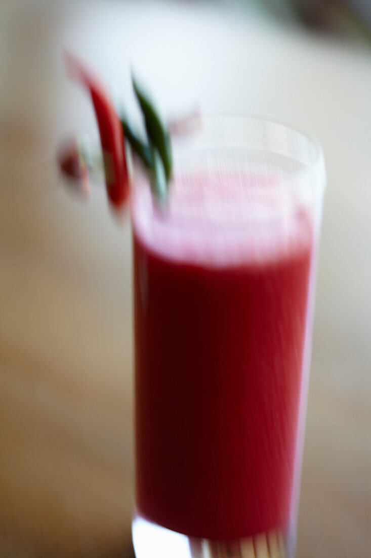Glass of tomato juice, blurred motion