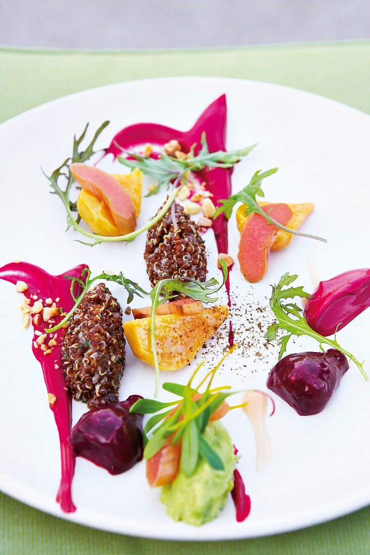 Salad with red quinoa, colourful beets and avocado