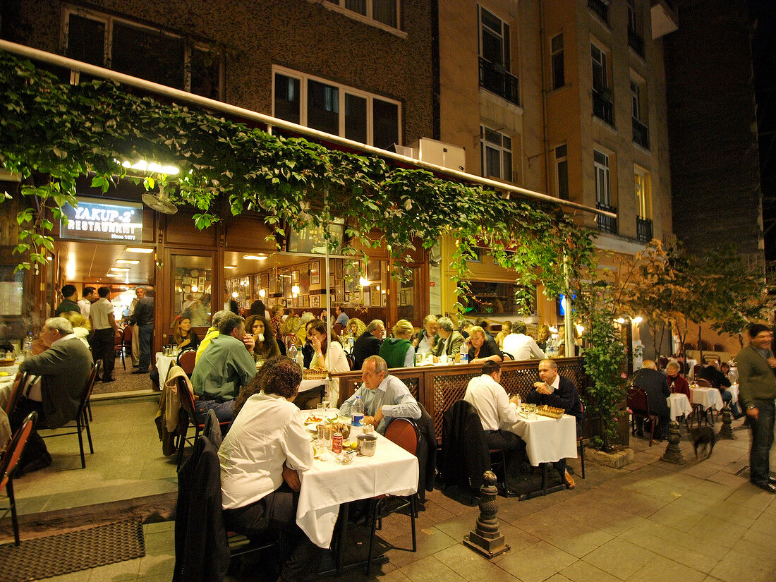 People dinning at restaurant Yakup at night in Istanbul, Turkey