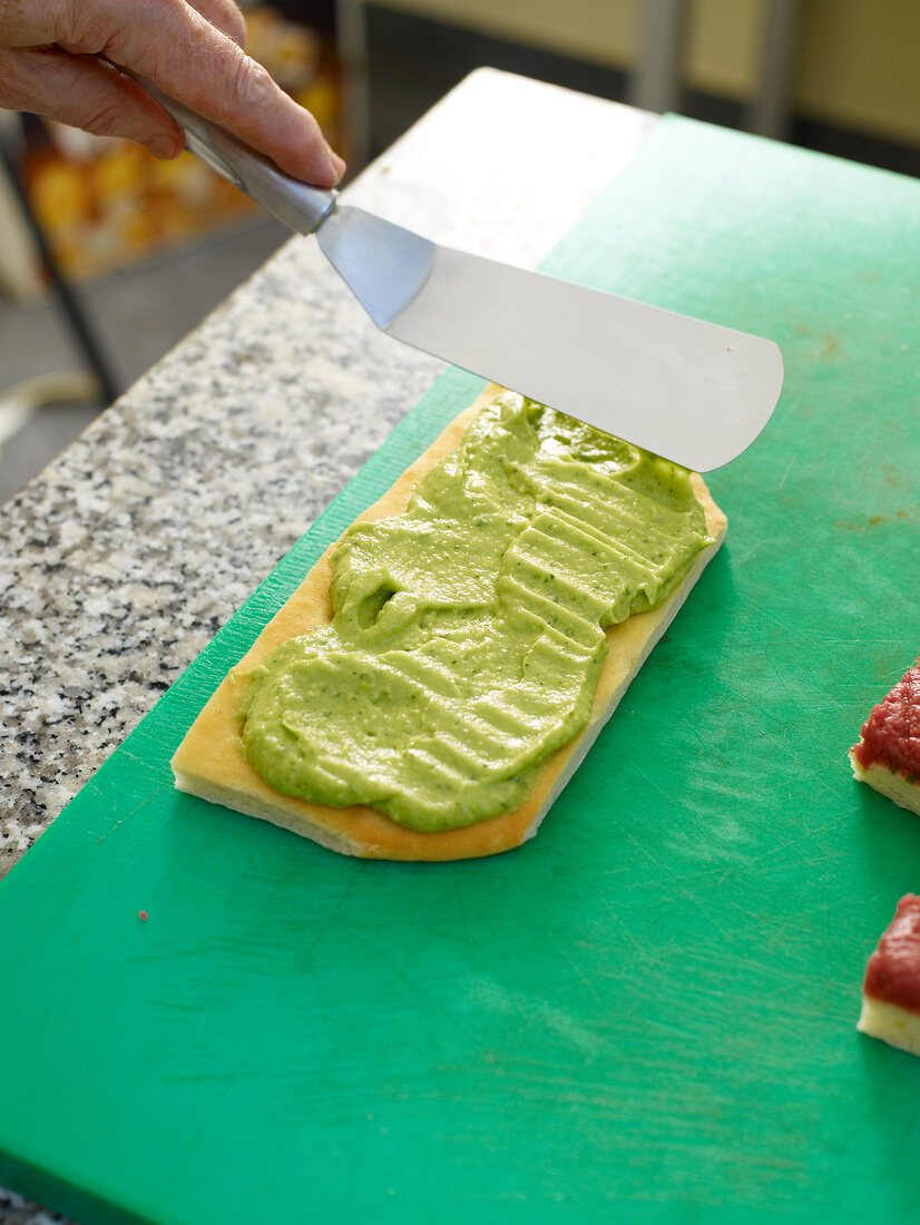 Elapse avocado cream being applied on focaccia