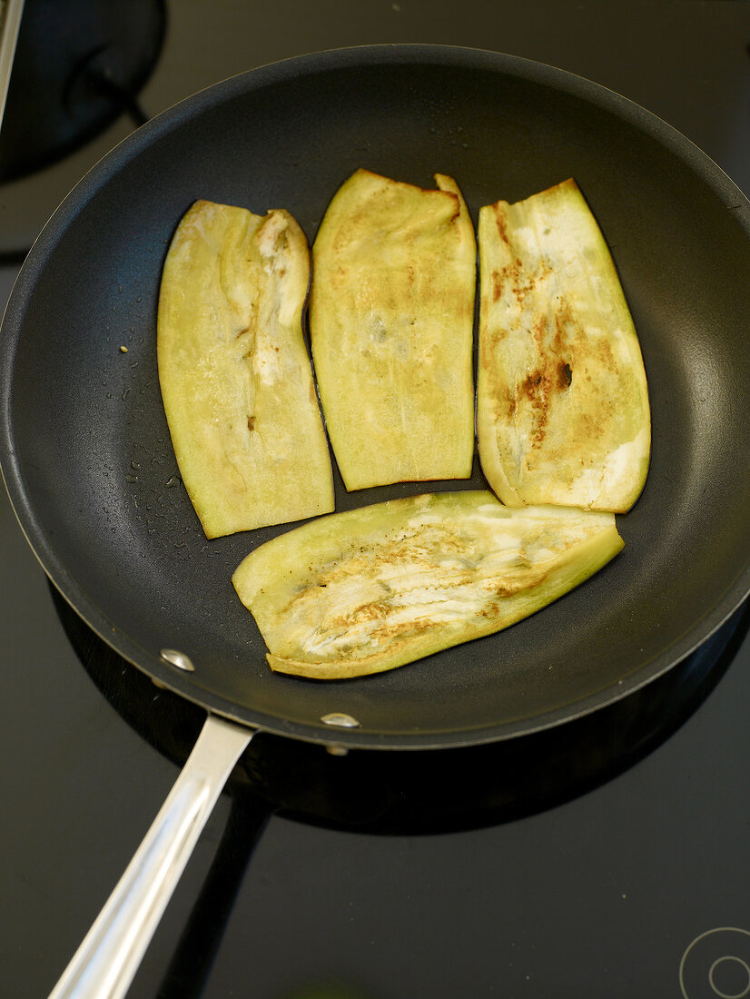 Eggplant slices in roasting pan
