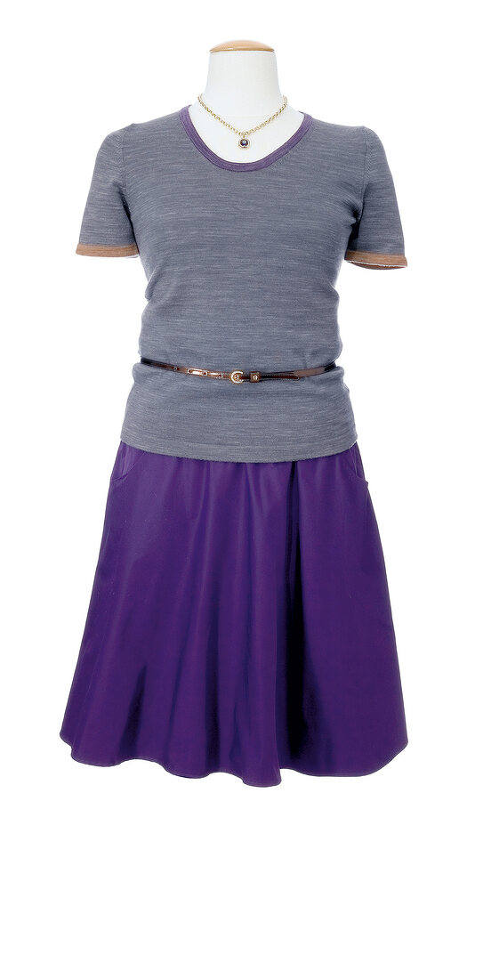 Gray top with purple taffeta skirt on mannequin against white background