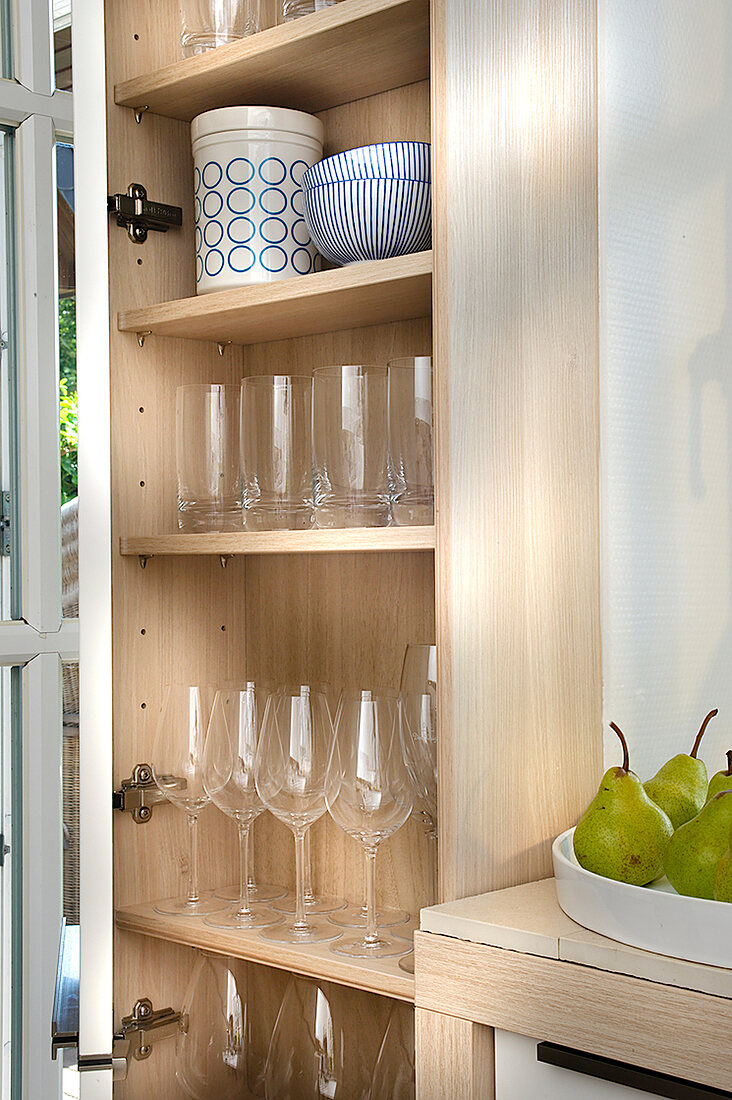 Close-up of kitchen shelf with glasses