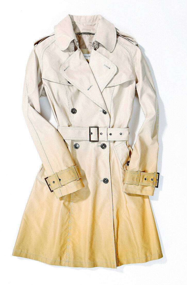 Beige trench coat on white background
