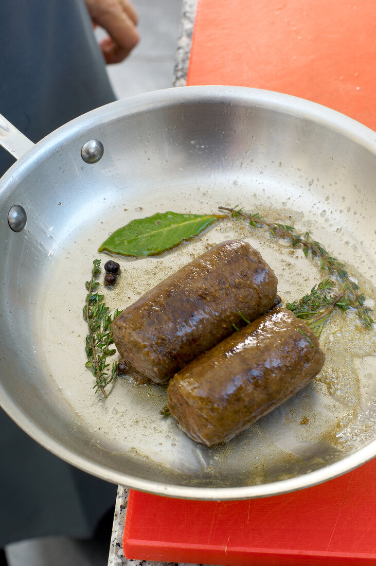 Venison being fried in pan