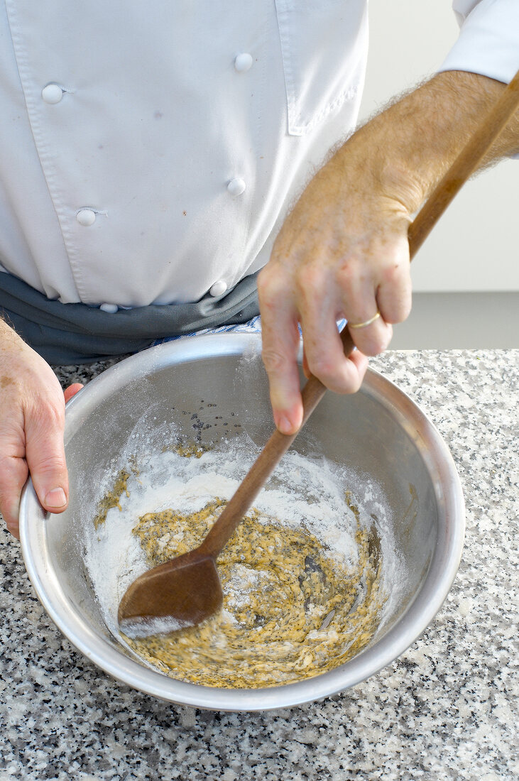 Mixing ingredients for poppy spaetzle in bowl