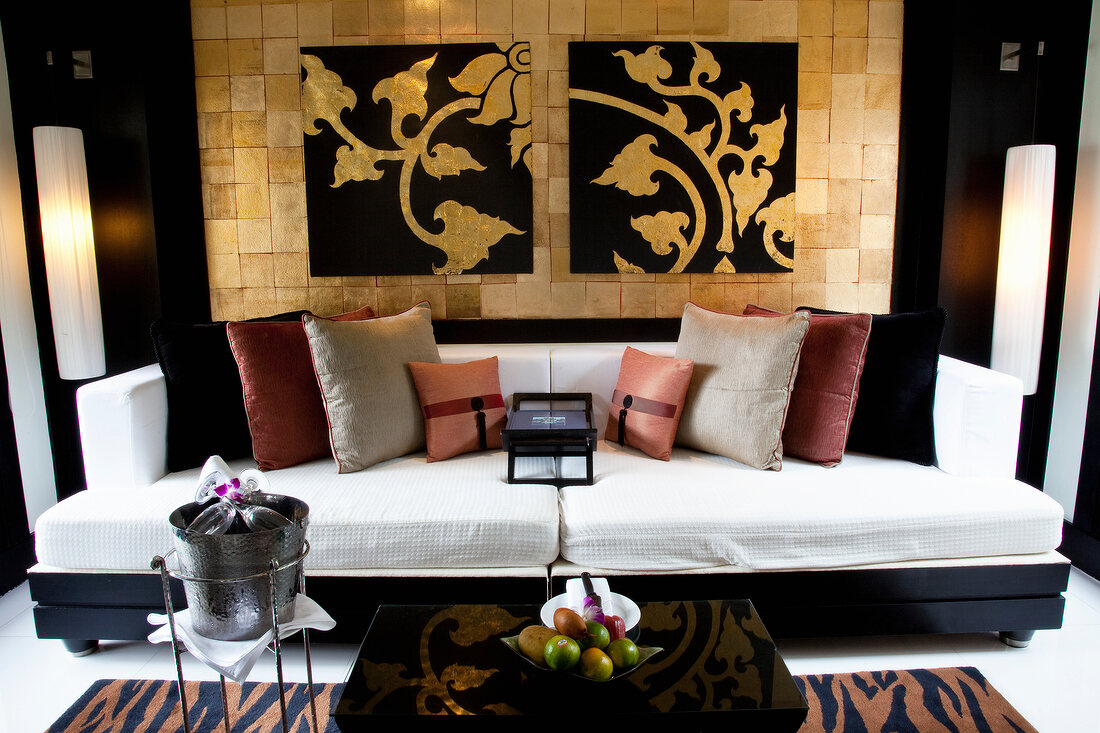 Close-up of lounge with sofa and cushions at luxury hotel in Phuket, Thailand