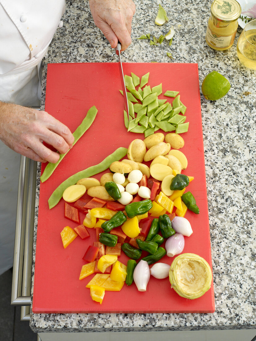 Chopping vegetables on cutting board