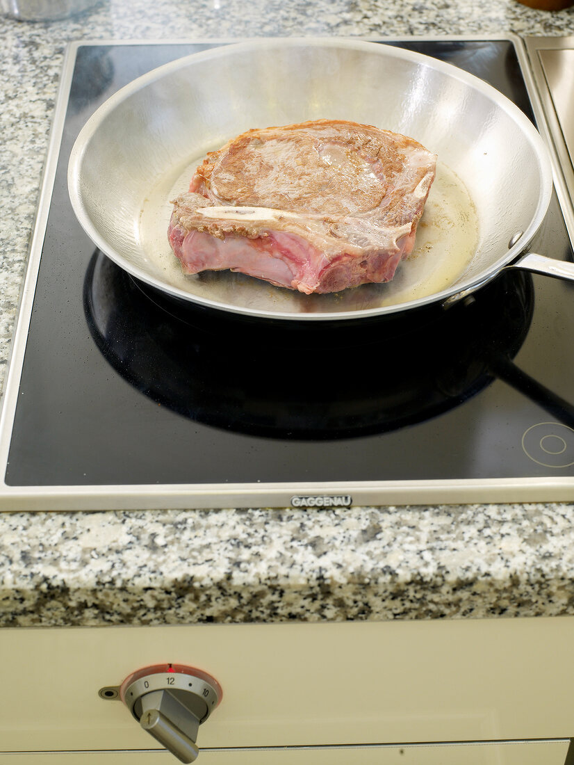 Beef steak in frying pan
