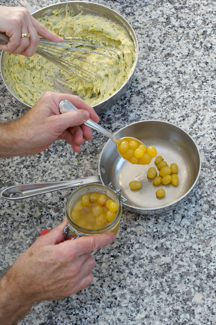 Putting moscato grapes in saucepan