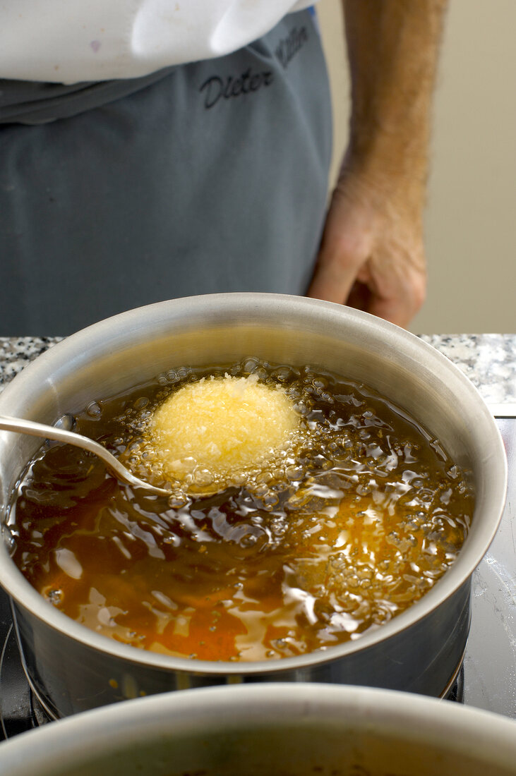 Deep frying dumplings in pan