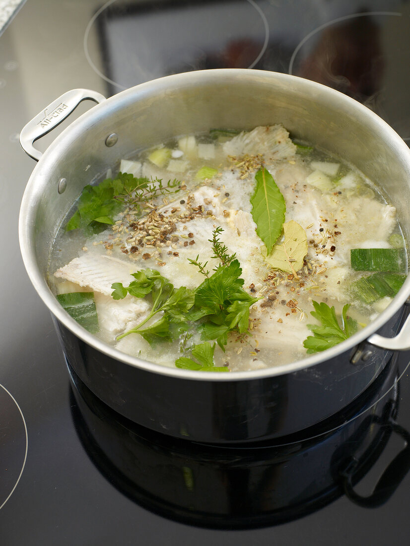 Close-up of fish stock mixture in pot