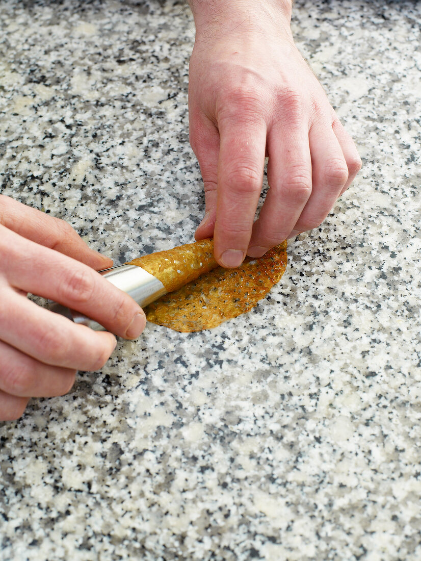 Close-up of circle being rolled on cone