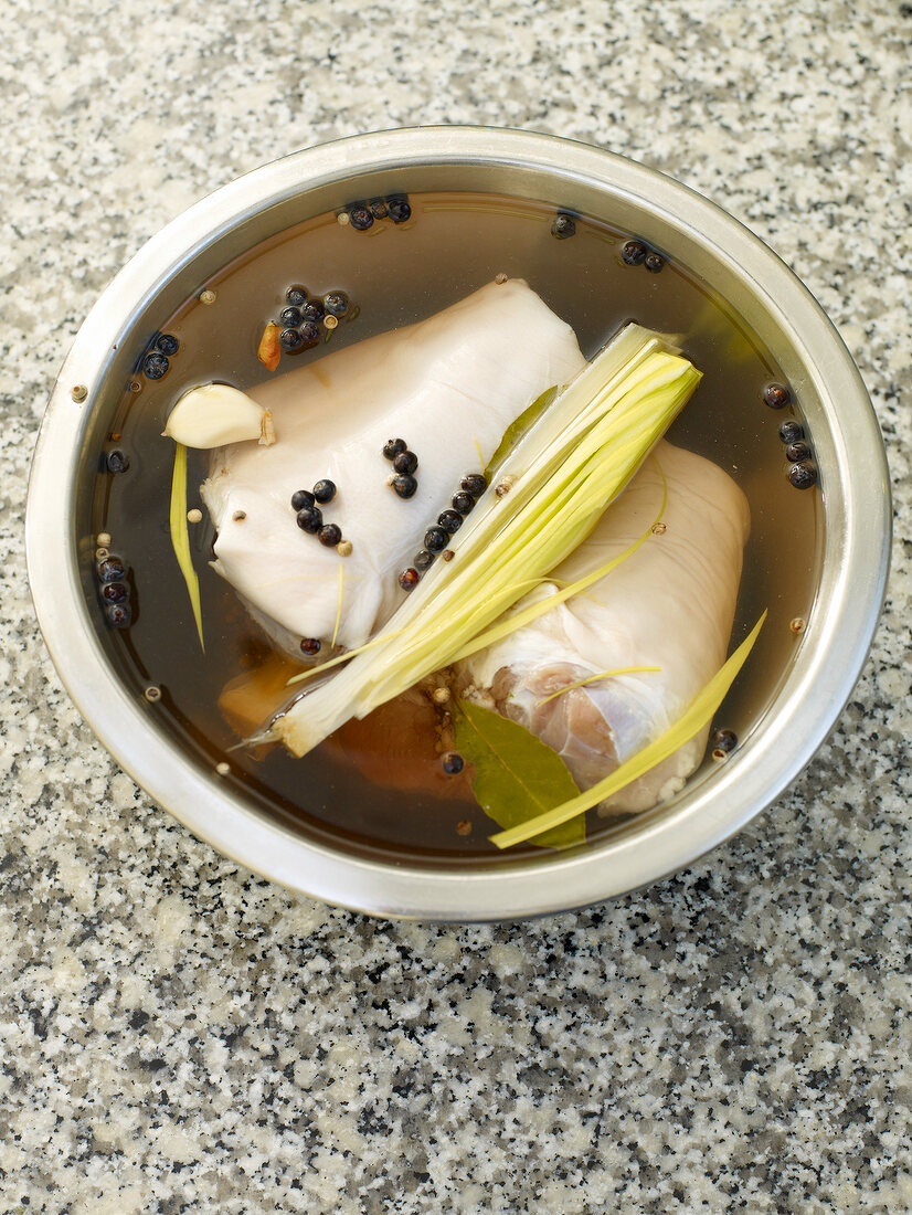 Pork with spices in stew for soup preparation in bowl