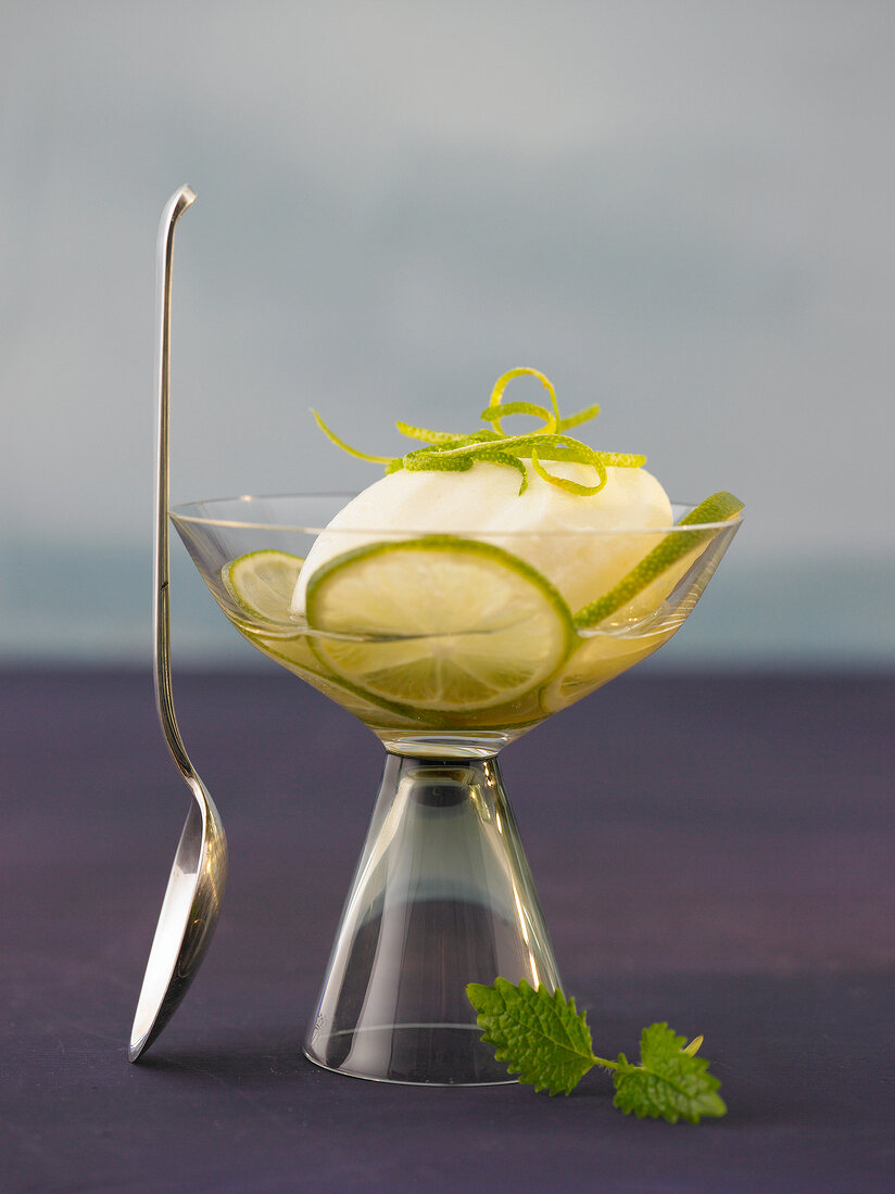 Close-up of elderflower mousse with lime in glass