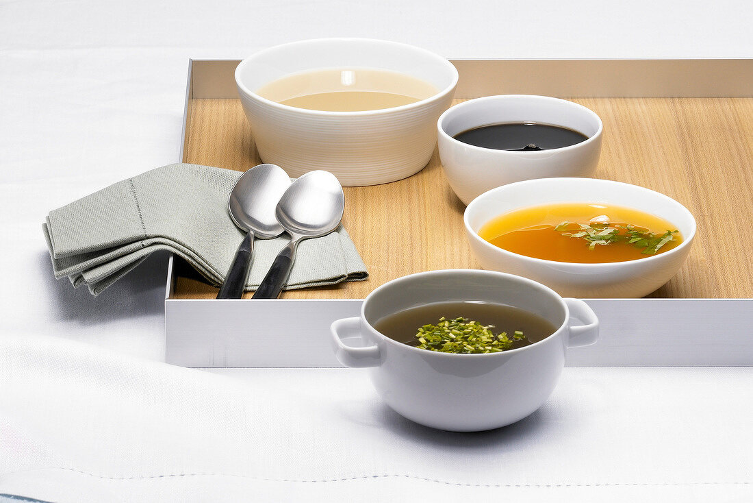 Four bowl of various soups