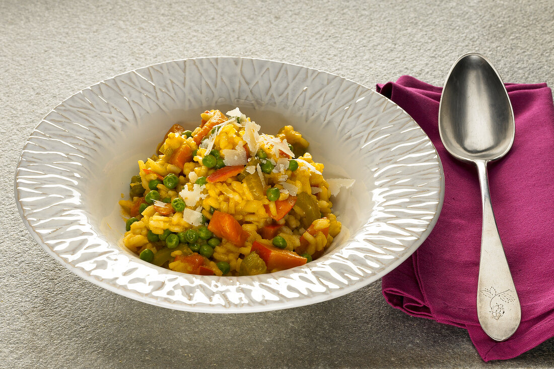 Pumpkin and pea risotto on plate