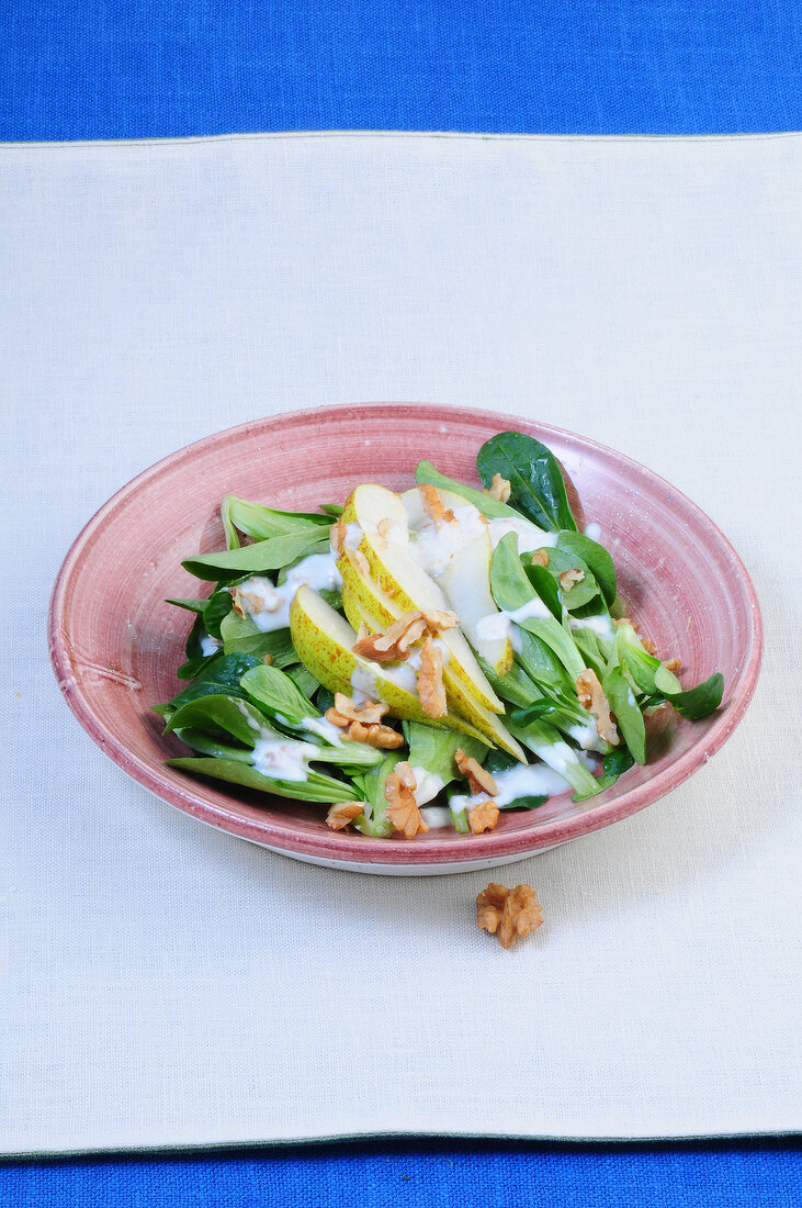 Corn salad with walnuts in bowl