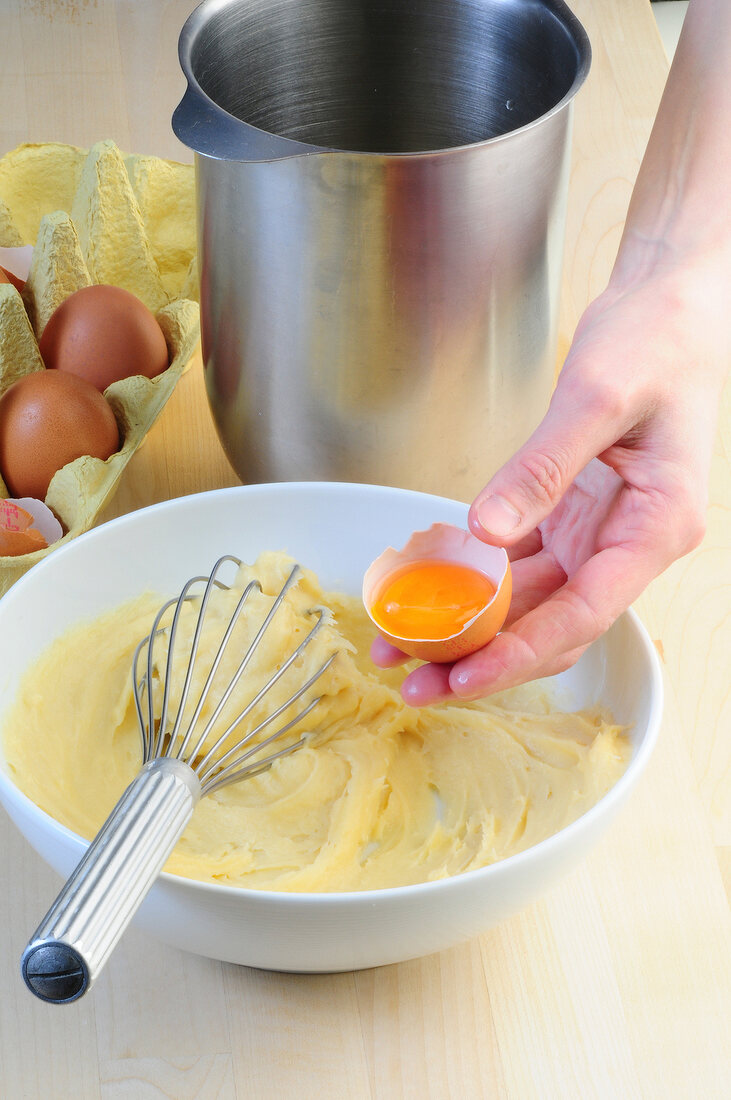 Egg yolk added to whipped cream, step 1