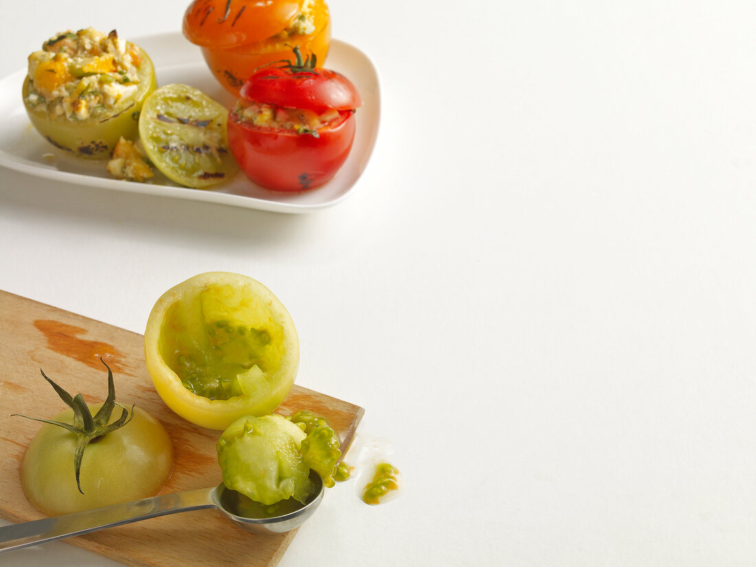 Tomatoes stuffed with sheep's cheese on serving dish