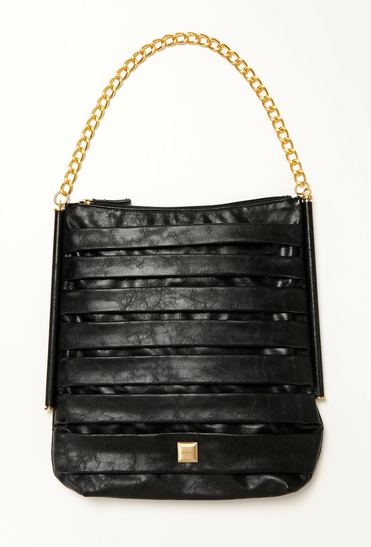 Black bag with golden link chain handle on white background