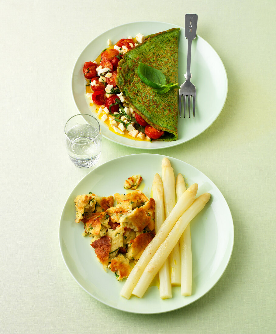 Two plates of spinach pancakes and wild garlic kratzete