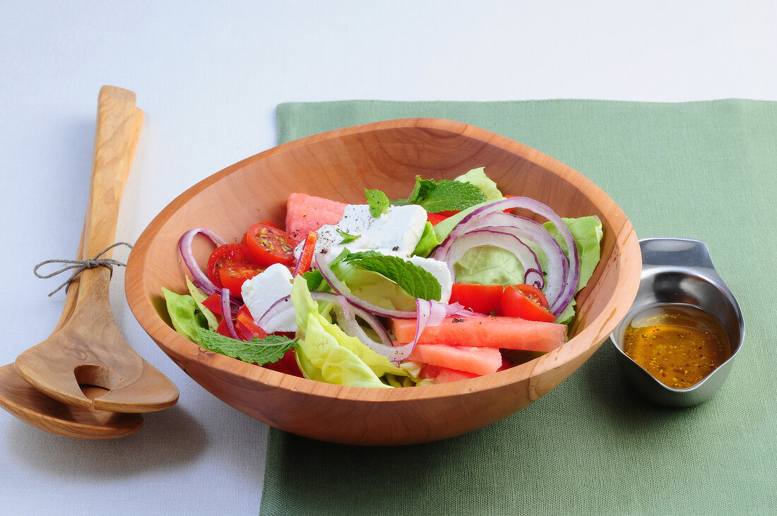 Greek salad with feta cheese and watermelon in bowl