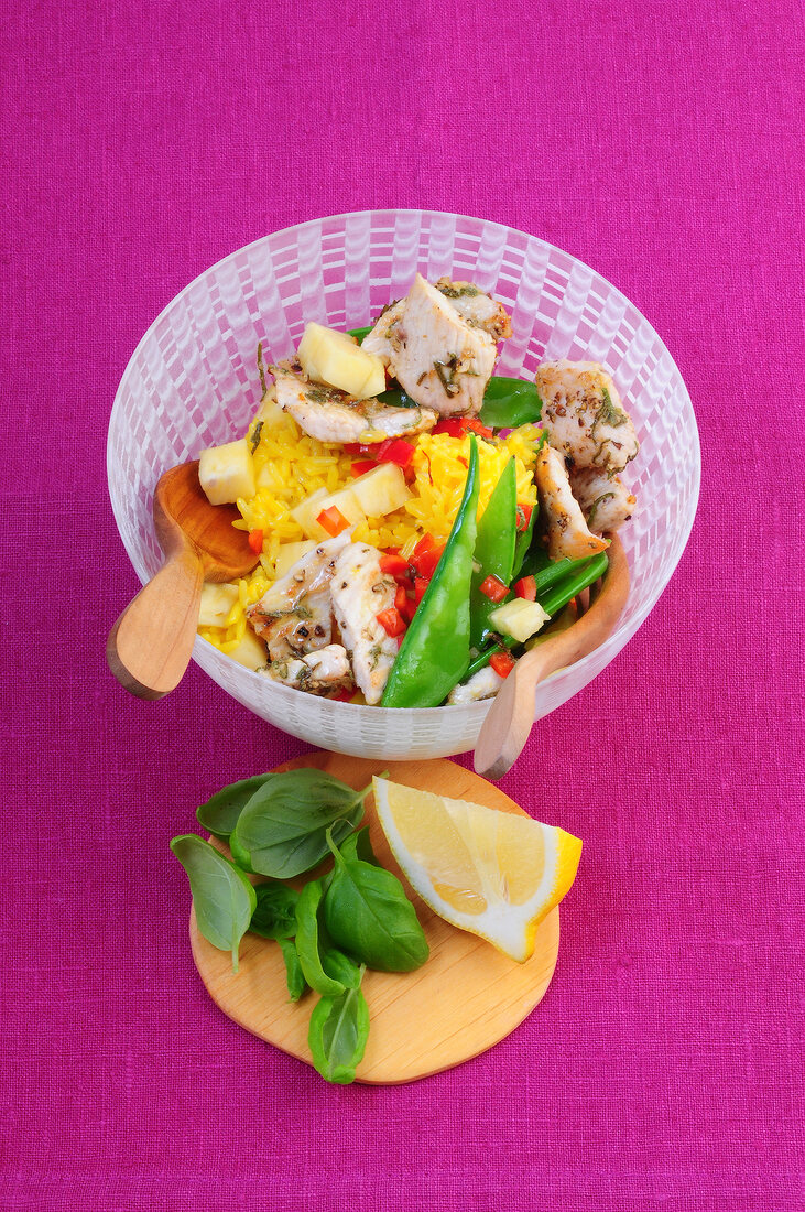 Rice salad with turkey breast and pineapple in bowl