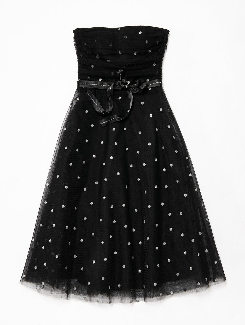 Black corset dress with tulle and silver dots on white background