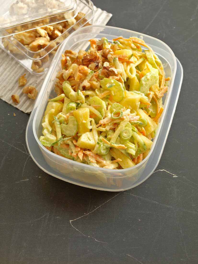 Vegetable salad with pineapple in plastic box