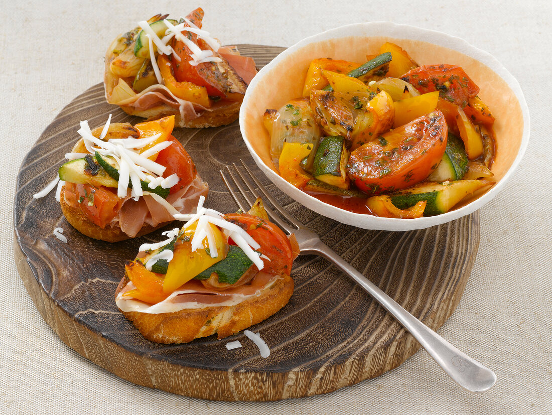 Mediterranean vegetables in bowl and on crostinis