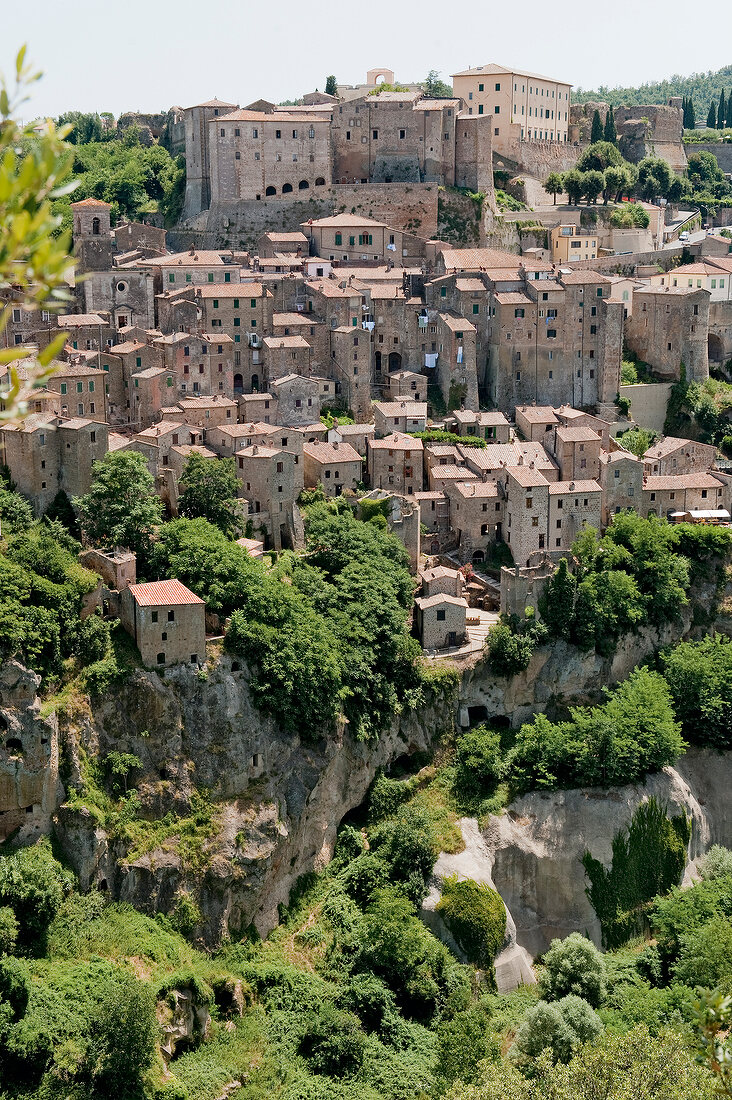 View of Sorano town on rocky plateau in Maremma, Tuscany, Italy