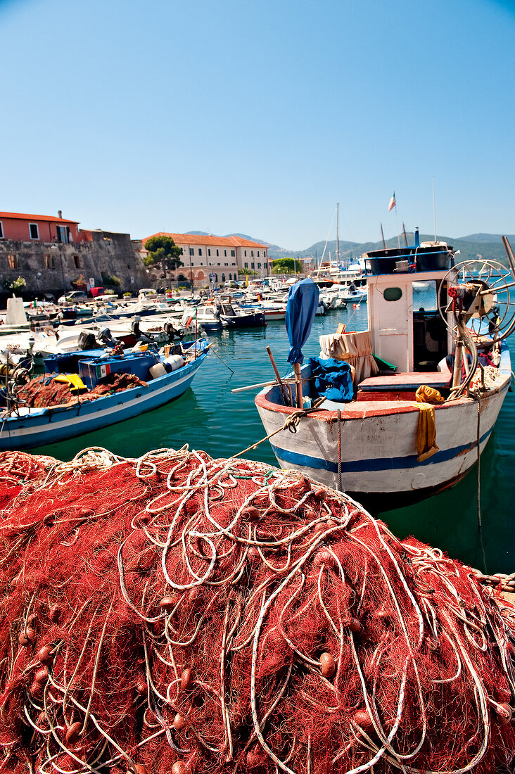 Fishing boats with jumbled fishing nets at Portoferraio port, Elba Island, Tuscany, Italy