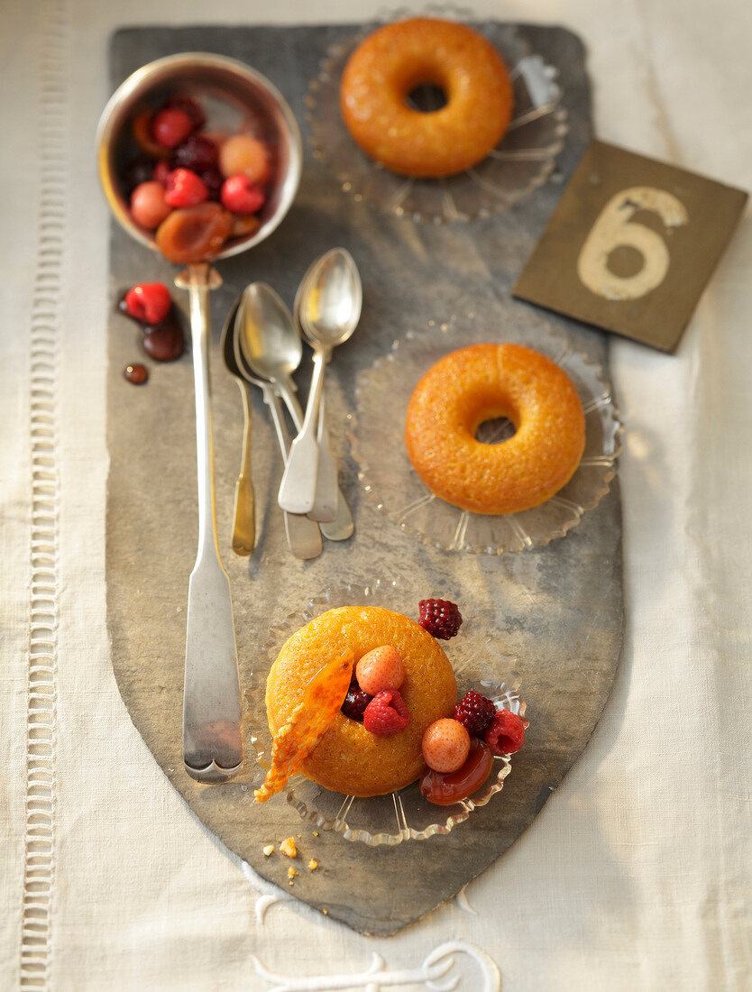 Savarins with rum fruits and brittle in serving dish