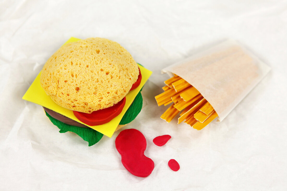 Burgers and fries on white background