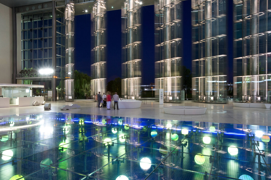 Reflection of illuminated building on glass flooring, Autostadt, Wolfsburg, Germany