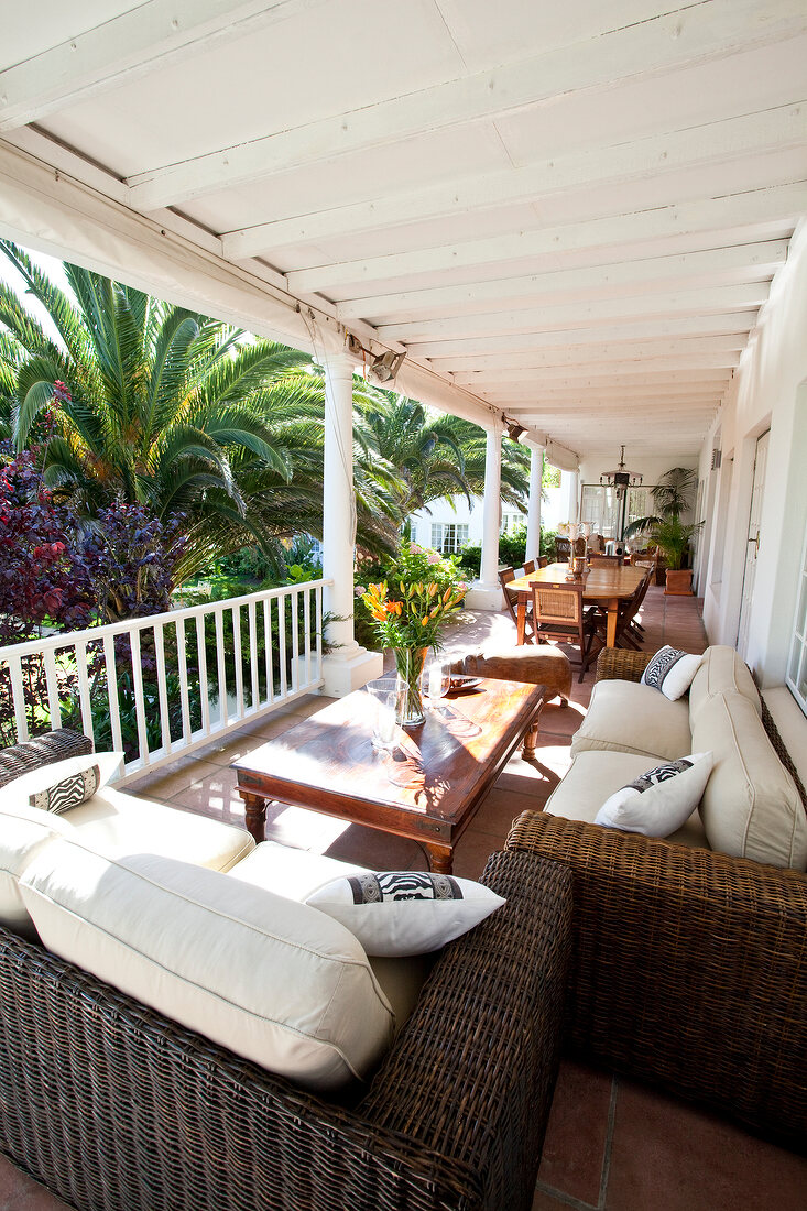 View of Villa Coloniale porch with wicker furniture, Cape Town, South Africa