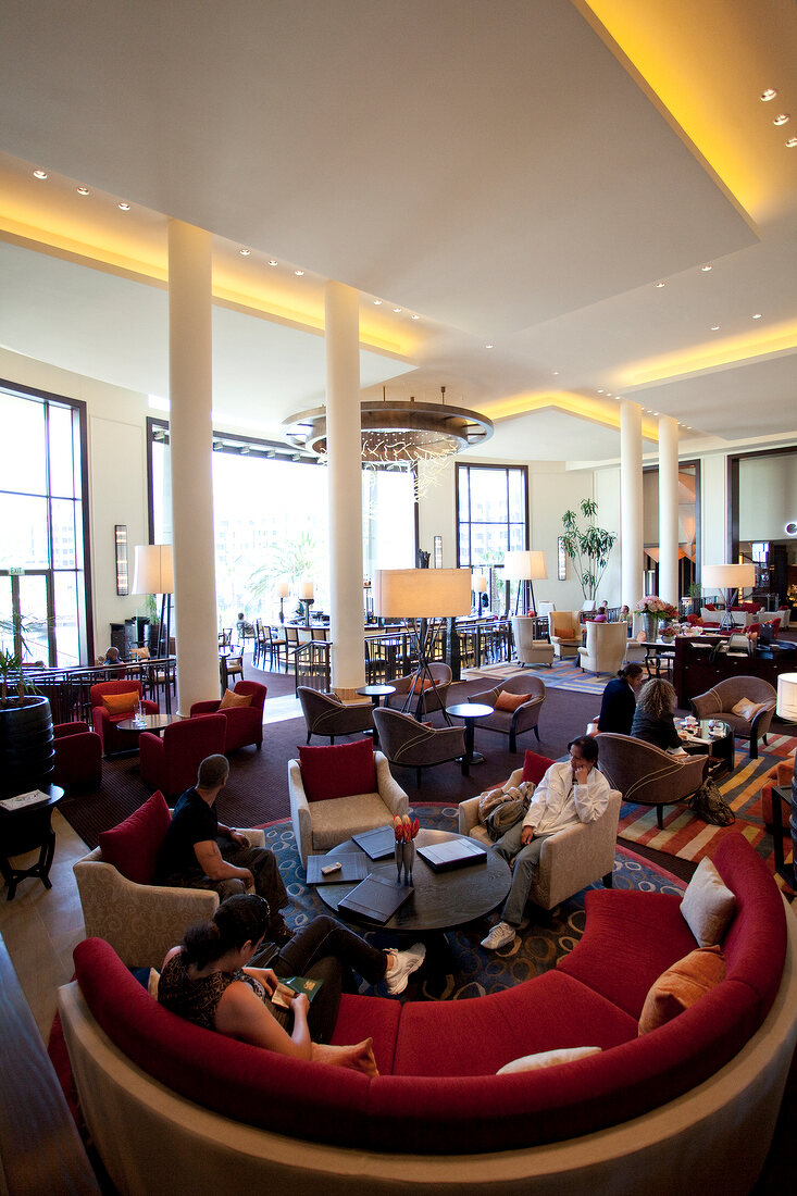 People sitting in lounge of One & Only Cape Town Luxury Hotel, South Africa