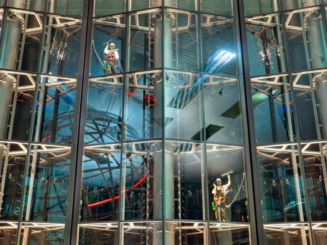 People cleaning glass front of the group forum, Autostadt Wolfsburg, Germany