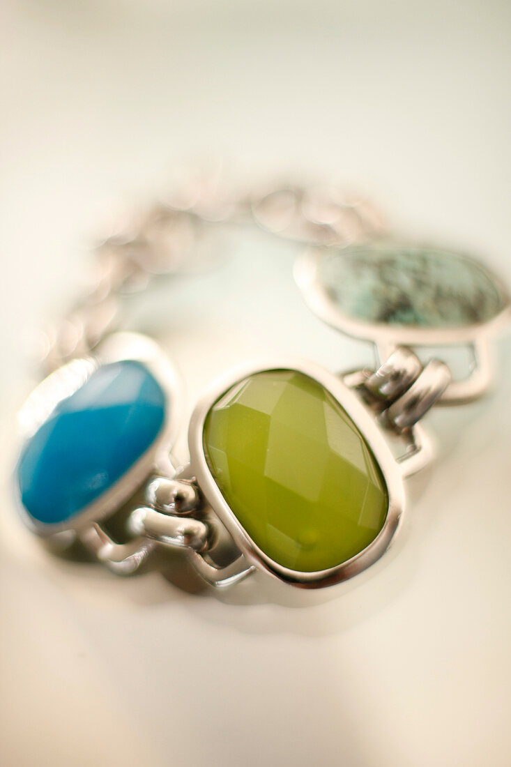 Close-up of bracelet with stones in green and turquoise