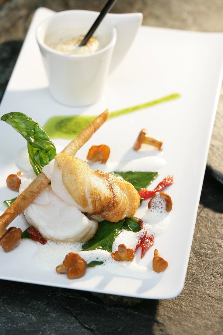 Monkfish with cappuccino and chanterelle on plate