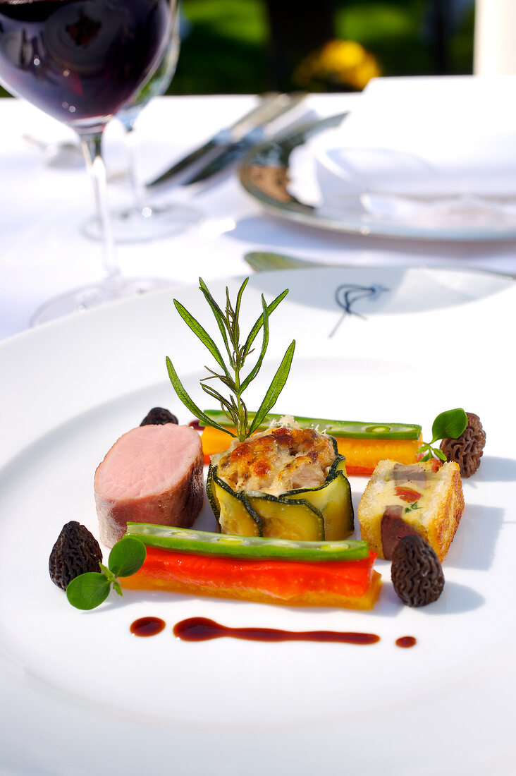 Trio of Sisteron lamb meat on plate, close-up