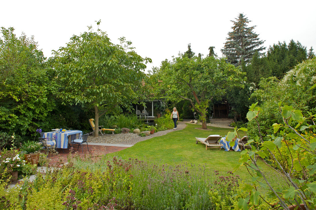 Vegetable garden with various seating under trees