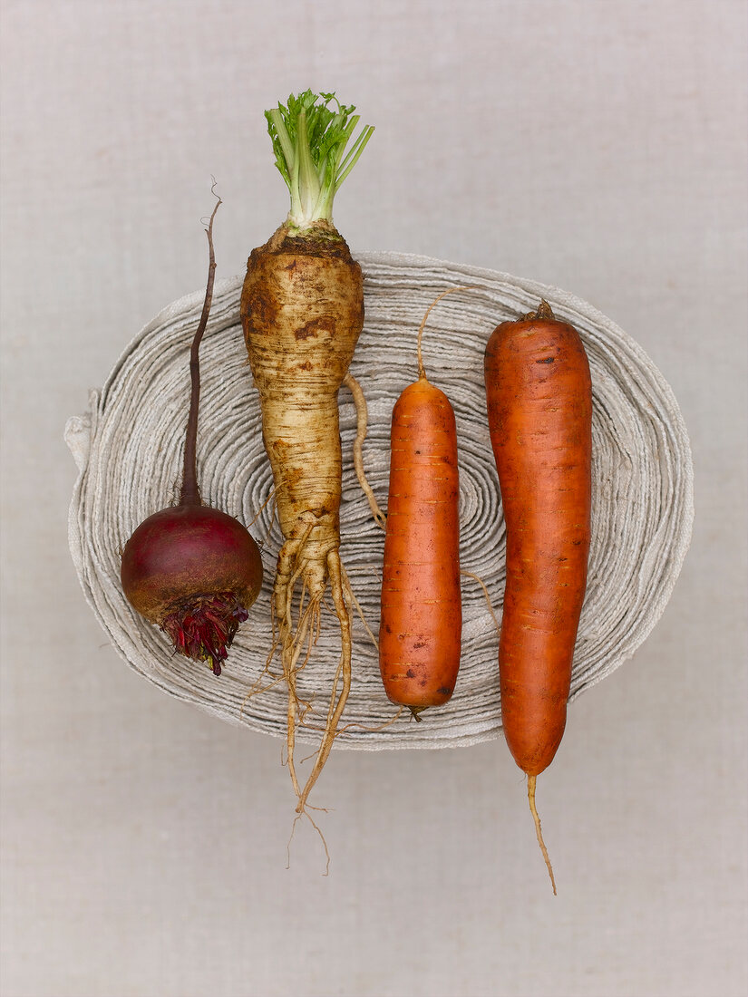 Beetroot, parsley root and carrots in wicker basket